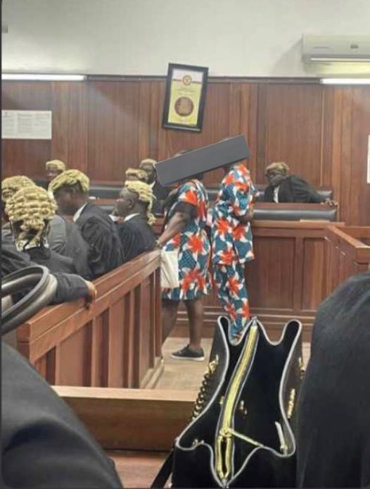 A couple seeking divorce arrives in court in matching outfits.